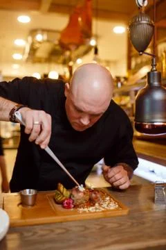 Chef in a black uniform jacket Stock-Fotos