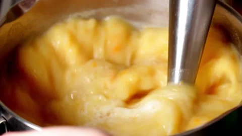 Chef with blender making pumpkin soup in the kitchen Stock Footage 201211814