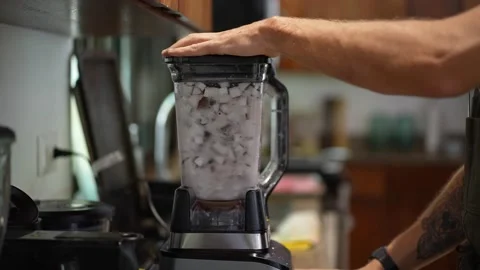 Chef blends coconut into coconut milk. healthy ingredients for gourmet dish.  Stock Footage 207912056