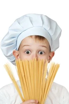 Chef boy is hiding behind a spaghetti. isolated Stock Photos