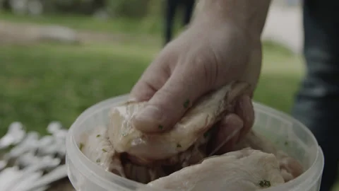 Chef Boy Taking Raw Chicken Meat from Marinade Stock Footage 144798052
