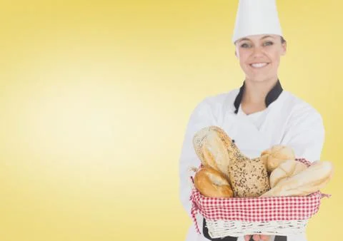 Chef with bread against yellow background Stock Photos