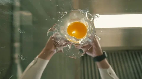 The chef breaks an egg Stock Footage 148499239