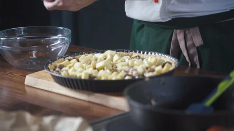 Chef breaks eggs to make omelette or dough for a pie, cake, pizza. Stock-Footage 124754164