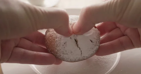 The chef breaks open a cake or muffin to display the filling. Close-up. Stock Footage 200898160