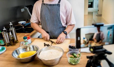 The chef is broadcasting live from workshop how to prepare a vegetarian food Stock Photos