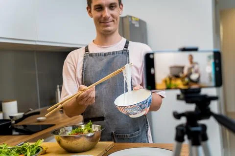 The chef is broadcasting live from workshop how to prepare a spicy glass noodle Stock Photos