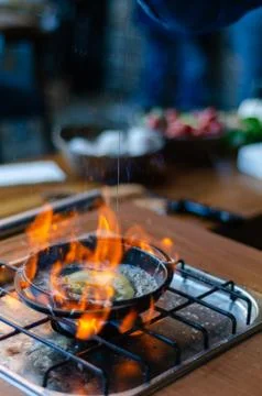 The chef broke the egg into the pan.. Stock Photos