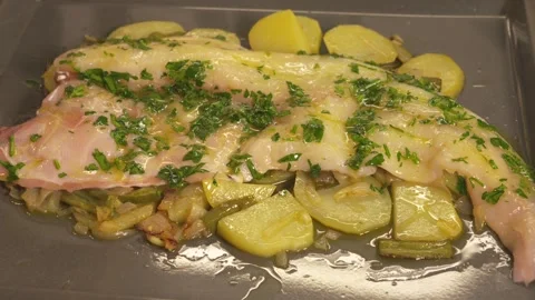 Chef brushing oil on a raw monkfish fillet Stock Footage 331314040