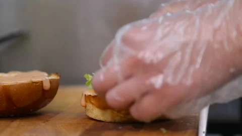 The chef is building a burger Stock Footage 98991661