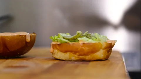 The chef is building a burger Video stock 98995053
