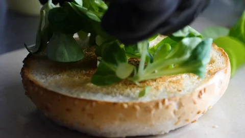Chef builds burger. Preparing of the burger Stock Footage 86177620