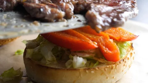 Chef builds burger. Preparing of the burger Stock Footage 86178059