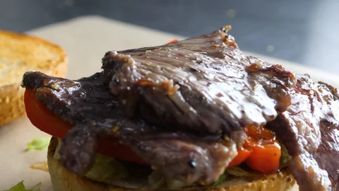 Chef builds burger. Preparing of the burger Stock Footage 86178066