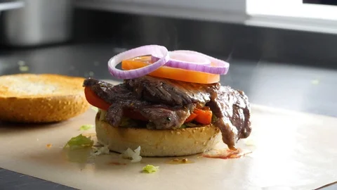 Chef builds burger. Preparing of the burger Stock Footage 86178187