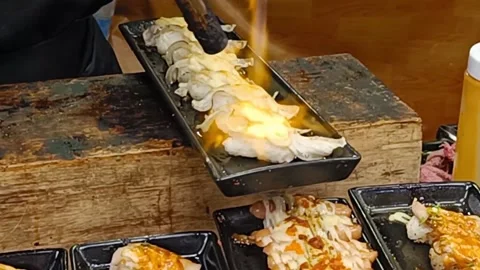 Chef is burning fish sushi in Thailand's local market. Stock Footage 218291886