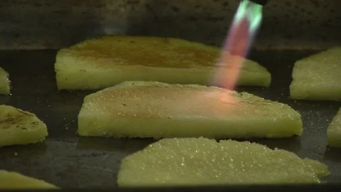 Chef caramelising pineapple slices Stock Footage 90732139