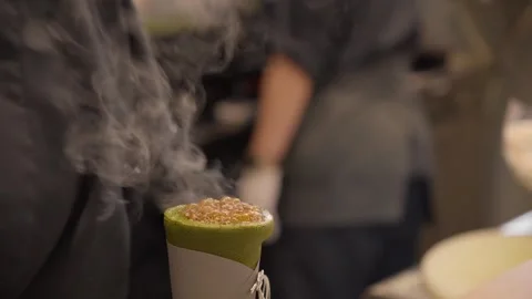 Chef caramelizing matcha green tea crepe with blowtorch Stock Footage 340253622