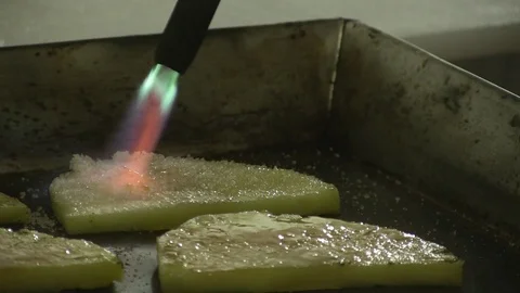 Chef Caramelizing Pineapple Slices on Hot Grill Alternate Angle with Flame Stock Footage 90732174
