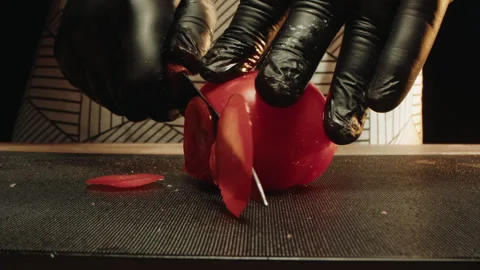 Chef carefully cuts vibrant tomatoes into translucent perfect slices Video stock 331848649