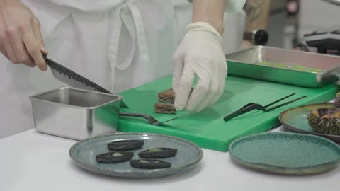 Chef carefully cutting fruit marshmallow slices Stock Footage 304317546