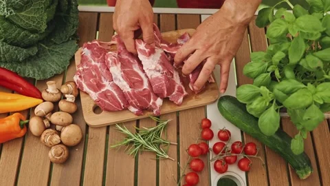 The chef carefully selects the delicious raw steak for the grill. Delicious and 스톡 동영상 202137836