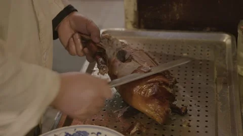 Chef Carving Roasted Poultry in Beijing Restaurant Kitchen, Close Up Food Stock Footage 345773018