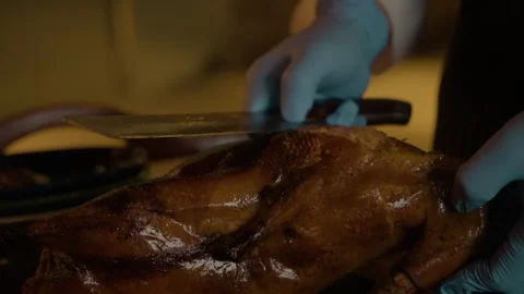 Chef Carving Roasted Poultry with Cleaver in Beijing Restaurant Kitchen Stock Footage 345782187