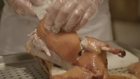 Chef Carving Roasted Poultry on Tray in Beijing Restaurant Kitchen, China Stock Footage 345833548