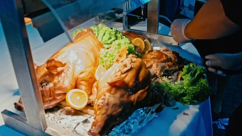The chef carving the suckling pig Stock Footage 70533335