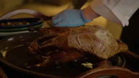Chef Carving Whole Roasted Bird on Platter in Beijing Restaurant Kitchen Stock Footage 345781901
