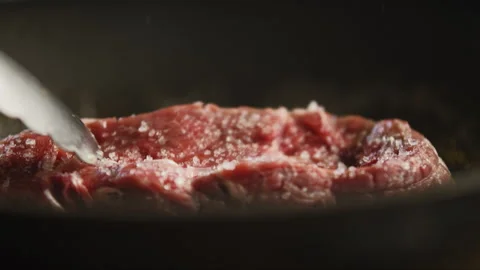 Chef checking the meat while its frying on the fire Stock Footage 274621857