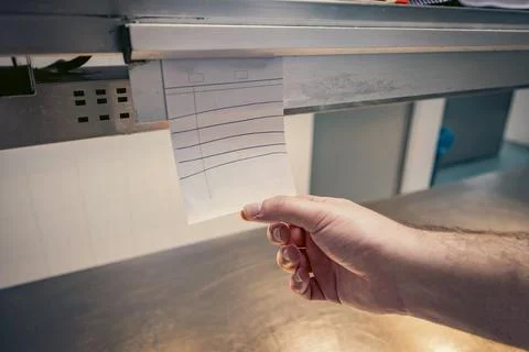 Chef checking restaurant orders in a professional kitchen Stock Photos
