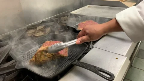 Chef Checks Flank Steak Sizzling In Pan Stock Footage 230919487