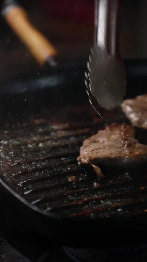 A Chef Checks A Steak Being Cooked In A Pan Stock Footage 296023167