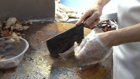 Chef of China restaurant is slicing roasted Peking Duck. Beijing, China. Stock Footage 92879017