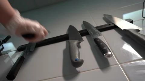 Chef chooses a professional knife on a restaurant Stock Footage 149964684