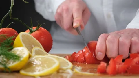 Chef choping tomatoes Stock Footage 228880556