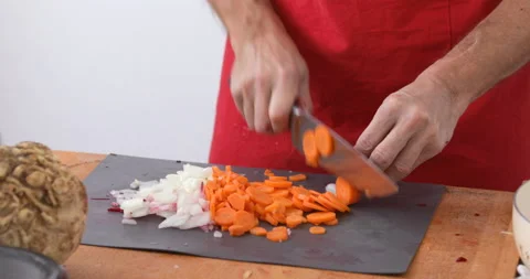 Chef chopping carrot, close up Stock Footage 147509800