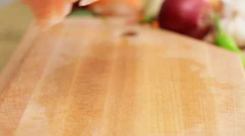 Chef chopping chicken brests onto cubic chunks, closeup Stock Footage 56346533