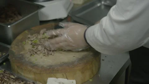 Chef Chopping Cooked Meat and Vegetables on Wooden Board in Beijing Street Food Stock Footage 345856730