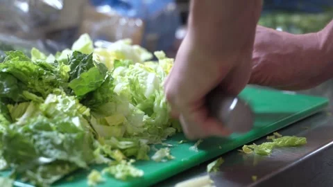 Chef Chopping Fresh Vegetables on Cutting Board in Commercial Kitchen Stock Footage 321366438