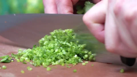 Chef Chopping Fresh Vegetables on Cutting Board in Commercial Kitchen Stock-Footage 321366693