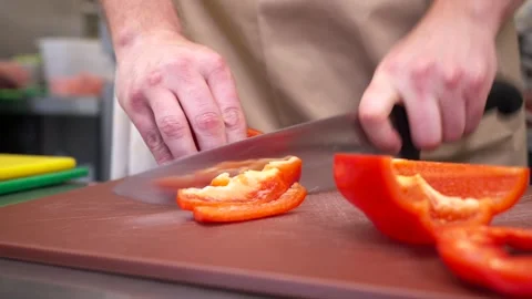 Chef Chopping Fresh Vegetables on Cutting Board in Commercial Kitchen Stock-Footage 321367151