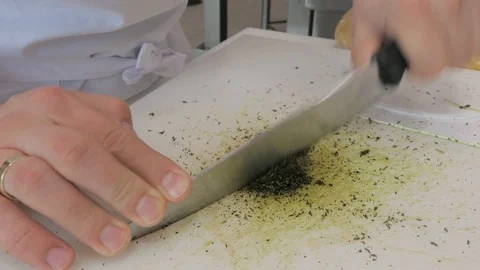 Chef chopping herbs on white board Stock Footage 89989589
