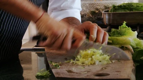Chef Chopping Lettuce In Kitchen Stock Footage 106946932