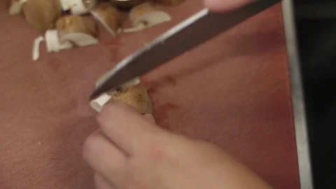 Chef chopping mushrooms in kitchen table restaurant slow motion Stock-Footage 78582788