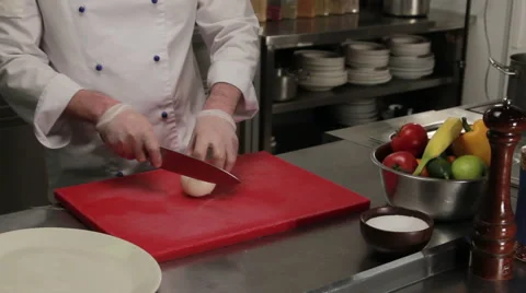 Chef chopping onion into rings, medium shot Stock Footage 66061714