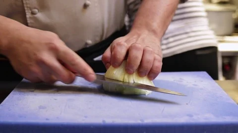 Chef chopping onions Stock Footage 72975786