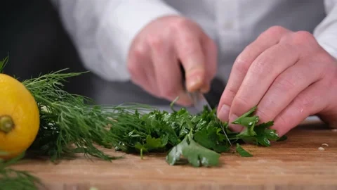 Chef chopping parsley Stock Footage 237344434
